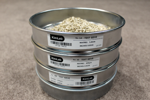 Stack of test sieves with milled grain